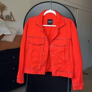 Vibrant Red/Orange Jacket with Colorful Stitching Accents
